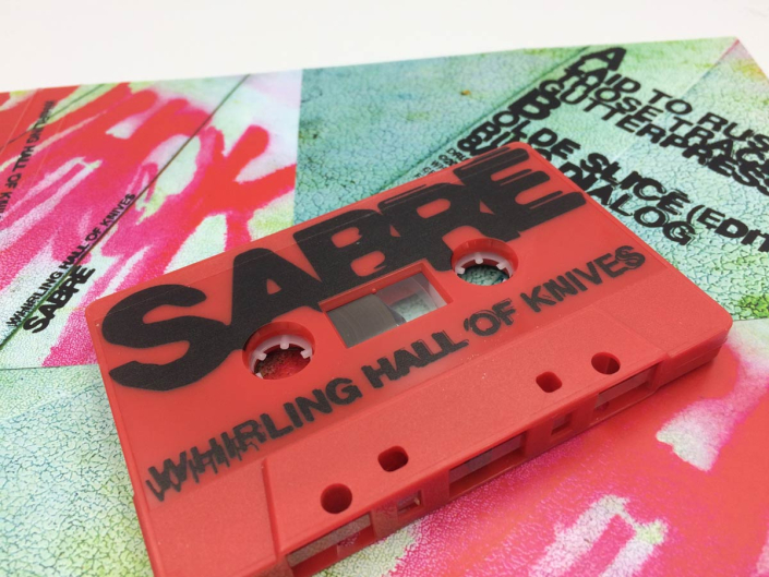 Cassette tape with printing on the shell.